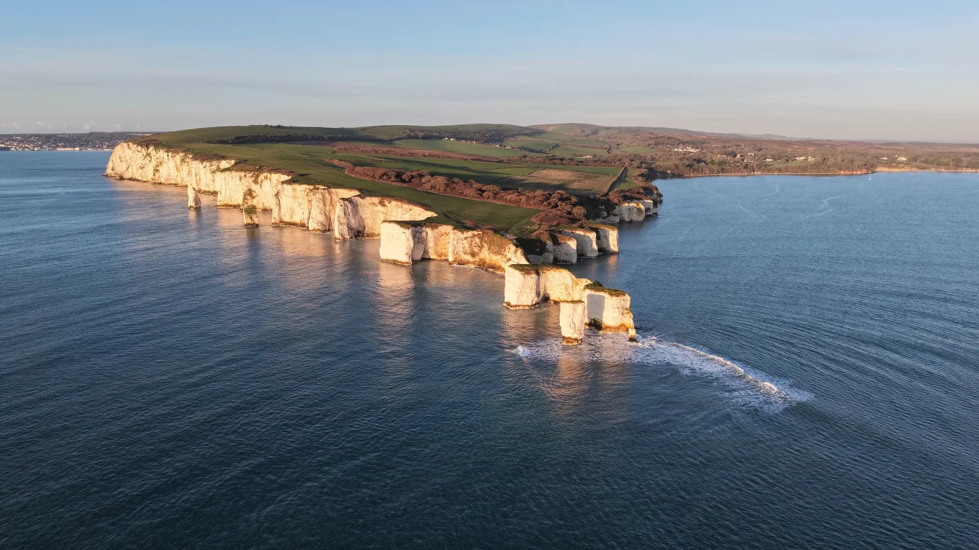 Aerial view of Old Harry Rocks in warm low light