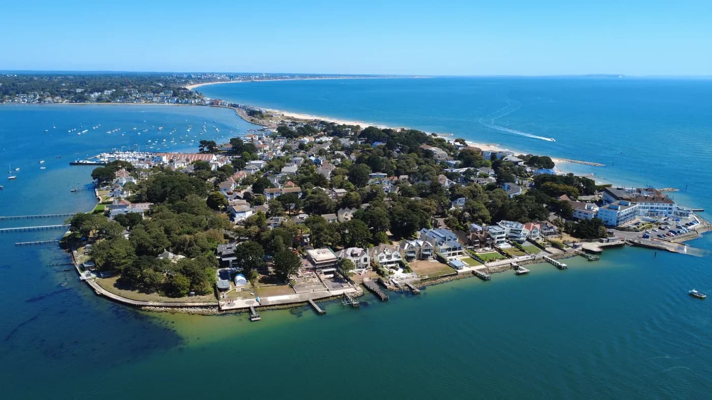Aerial view along Sandbanks Millionaires' Row and the harbour shoreline