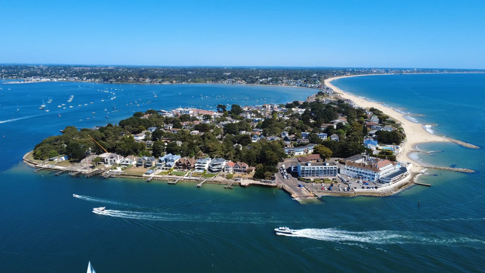 Aerial view of the Sandbanks peninsula between Poole Harbour and the open sea
